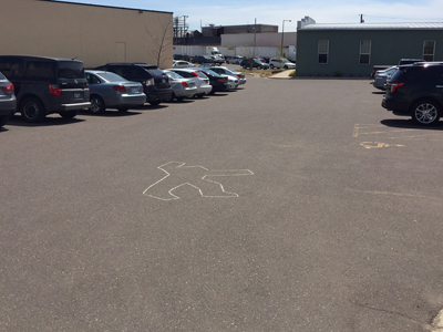 The parking lot at CodeWeavers. Note the shocking lack of BMWs and Porsches...